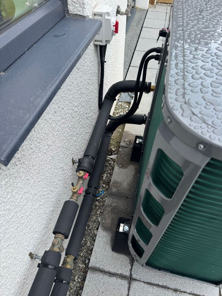 Uninsulated valves and brass components act as radiators, wasting heat energy.