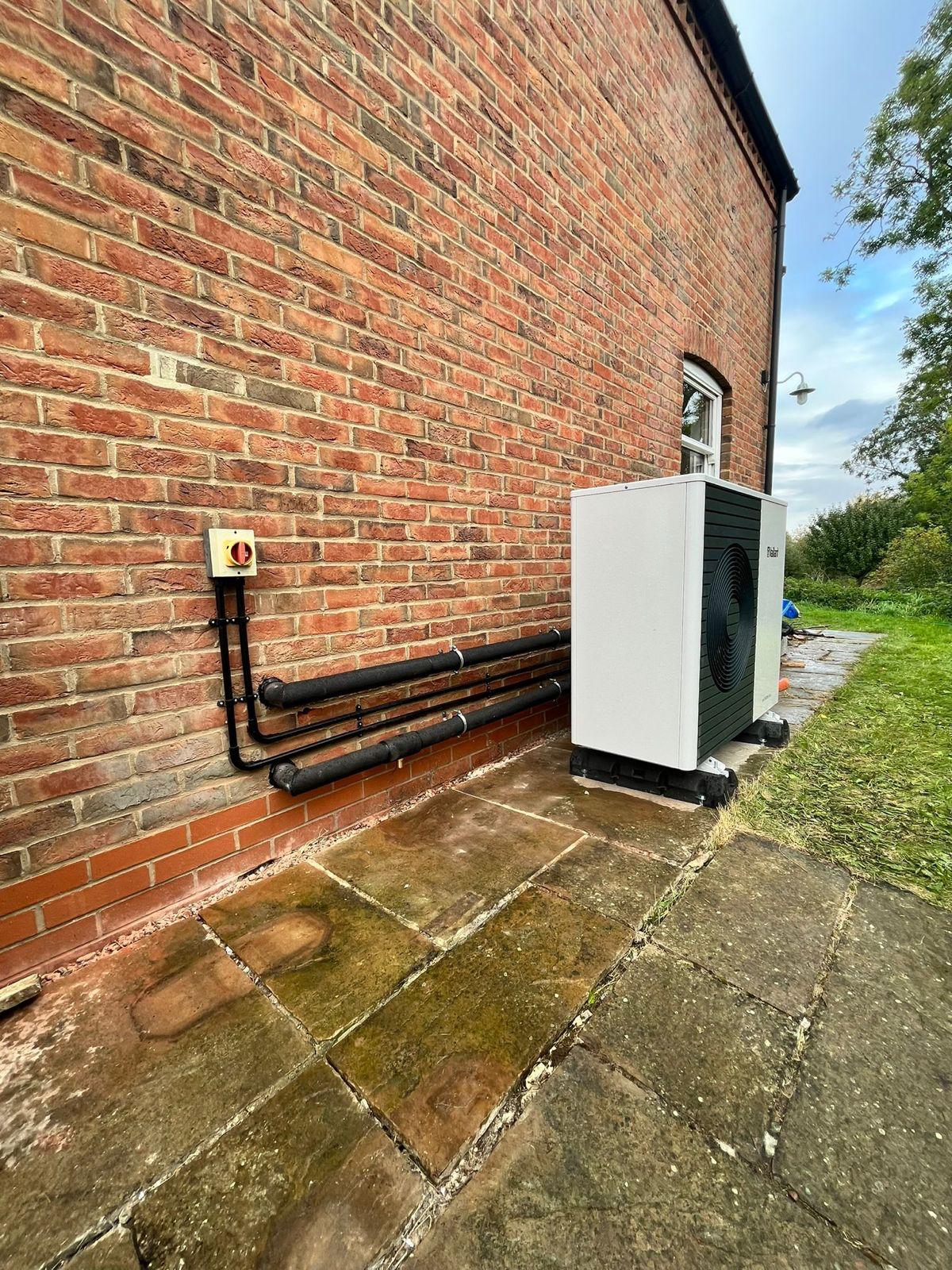 Heat pump pipework in good condition, showing complete, dry insulation with no gaps